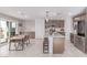 Modern kitchen with stainless steel appliances, a breakfast bar, and adjacent dining area at 360 Rosefinch St, Henderson, NV 89012