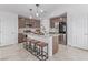Kitchen featuring stainless steel appliances, a granite countertop island, and wood-finished cabinets at 360 Rosefinch St, Henderson, NV 89012