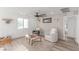 Bright and airy loft features plush seating, contemporary decor, wood flooring, and a large ceiling fan at 360 Rosefinch St, Henderson, NV 89012