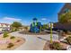 Community playground with modern play structure, landscaping, seating, and common area at 360 Rosefinch St, Henderson, NV 89012