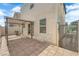 Backyard patio area with pavers, a pergola, and access to the home at 3677 Via El Monte Ave, Las Vegas, NV 89115