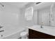 Well-lit bathroom with a vanity, bath-tub and shower combination, and a large mirror at 3677 Via El Monte Ave, Las Vegas, NV 89115