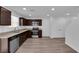Well-designed kitchen with stainless appliances, granite countertops, ample cabinet space, and vinyl floors at 3677 Via El Monte Ave, Las Vegas, NV 89115
