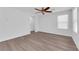 Bright and airy living area featuring sleek vinyl floors, contemporary ceiling fan, and neutral paint scheme at 3677 Via El Monte Ave, Las Vegas, NV 89115