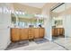 Bathroom with double sinks, vanity, and large mirror sliding door at 4217 Bridesmaid Falls Ave, North Las Vegas, NV 89085