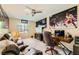 Spacious bedroom with a ceiling fan, comfortable seating, and a home office setup at 4217 Bridesmaid Falls Ave, North Las Vegas, NV 89085
