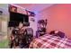 Bedroom with a plaid bed, desk, and posters on the wall creating a personalized space at 4217 Bridesmaid Falls Ave, North Las Vegas, NV 89085