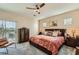 Bedroom with a plush bed, dresser, and a sliding door to the outside at 4217 Bridesmaid Falls Ave, North Las Vegas, NV 89085