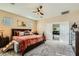 Spacious bedroom with a tiger art piece, ceiling fan and ample closet space at 4217 Bridesmaid Falls Ave, North Las Vegas, NV 89085