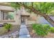 Charming home entrance with landscaped yard and decorative iron gate at 4217 Bridesmaid Falls Ave, North Las Vegas, NV 89085
