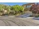 Charming two-story home featuring a well-manicured front yard, desert landscaping, and a two-car garage at 4217 Bridesmaid Falls Ave, North Las Vegas, NV 89085