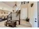 Inviting foyer with hardwood stairs and a view of the dining room at 4217 Bridesmaid Falls Ave, North Las Vegas, NV 89085