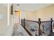 Hallway with iron railings, leading to the downstairs living areas and open floor plan at 4217 Bridesmaid Falls Ave, North Las Vegas, NV 89085