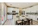 Modern kitchen with white cabinets, a center island with seating, and stainless steel appliances at 4217 Bridesmaid Falls Ave, North Las Vegas, NV 89085