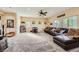 Large living room with movie decor, a spacious seating area, and natural light from the windows at 4217 Bridesmaid Falls Ave, North Las Vegas, NV 89085