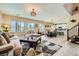 Open-concept living area with modern furnishings, dining space, and access to kitchen at 4217 Bridesmaid Falls Ave, North Las Vegas, NV 89085
