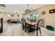 Spacious open floor plan featuring a living room and dining area with coordinated decor and ample natural light at 4217 Bridesmaid Falls Ave, North Las Vegas, NV 89085