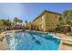 Spacious backyard oasis featuring a diving board and heated pool at 4217 Bridesmaid Falls Ave, North Las Vegas, NV 89085