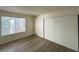 A clean bedroom featuring a window and closet with mirrored sliding doors at 4230 Gannet Cir # 216, Las Vegas, NV 89103
