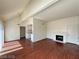 An inviting living room with wood floors, fireplace, and an open concept to the kitchen at 4230 Gannet Cir # 216, Las Vegas, NV 89103
