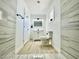 This is a bathroom featuring stone tile, wood flooring, and modern vanity at 4324 El Conlon Ave, Las Vegas, NV 89102