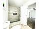 Modern bathroom with tiled shower and view into main bedroom at 4324 El Conlon Ave, Las Vegas, NV 89102
