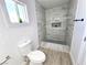 Modern bathroom with stone shower and pebble floor at 4324 El Conlon Ave, Las Vegas, NV 89102