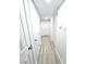 Hallway with multiple white doors and light wood-look flooring at 4324 El Conlon Ave, Las Vegas, NV 89102