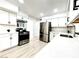 Modern kitchen featuring white cabinets, stainless steel appliances, and light wood flooring at 4324 El Conlon Ave, Las Vegas, NV 89102