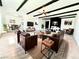 Staged living room highlighting beam ceilings, fireplace, and contemporary furnishings at 4324 El Conlon Ave, Las Vegas, NV 89102