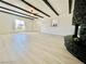 Open-concept living room with beam ceilings and plenty of natural light at 4324 El Conlon Ave, Las Vegas, NV 89102