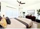Staged main bedroom featuring a bed, closet, and tv at 4324 El Conlon Ave, Las Vegas, NV 89102