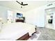 Bright main bedroom featuring a ceiling fan, TV, and doorway to the bathroom at 4324 El Conlon Ave, Las Vegas, NV 89102