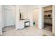 Large bright bathroom features a vanity, a toilet room, and a walk-in closet at 4364 Contour Bend Ave, North Las Vegas, NV 89084