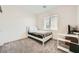Cozy bedroom featuring a large window for natural light and neutral decor for a relaxing atmosphere at 4364 Contour Bend Ave, North Las Vegas, NV 89084