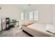 Neutral bedroom featuring soft gray carpet, a window, and space for a desk at 4364 Contour Bend Ave, North Las Vegas, NV 89084