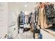 Walk-in closet complete with laundry units and plenty of storage and hanging space at 4364 Contour Bend Ave, North Las Vegas, NV 89084
