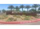 Landscaped entrance sign to Galaxy Park, featuring desert plants and palm trees at 4364 Contour Bend Ave, North Las Vegas, NV 89084