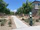 Community dog park with walkway, landscaping, and pet waste station, enhancing the neighborhood's appeal at 4364 Contour Bend Ave, North Las Vegas, NV 89084