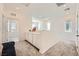 Bright hallway with lots of natural light boasts white cabinets and neutral paint to make it feel warm and inviting at 4364 Contour Bend Ave, North Las Vegas, NV 89084