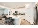 Bright kitchen with white cabinetry, stainless steel appliances, and a center island with bar seating at 4364 Contour Bend Ave, North Las Vegas, NV 89084