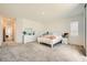Large main bedroom featuring neutral walls, gray carpet, and natural light from the windows at 4364 Contour Bend Ave, North Las Vegas, NV 89084