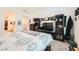 Spacious main bedroom with an entertainment center and doorway to the bathroom and walk-in closet at 4364 Contour Bend Ave, North Las Vegas, NV 89084