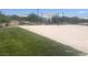 Sand volleyball court alongside green grass, shaded by canopy structures at 4364 Contour Bend Ave, North Las Vegas, NV 89084