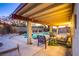Outdoor patio featuring a pool, several chairs and tables, concrete pavers, and garden features at 4539 Peardale Dr, Las Vegas, NV 89147