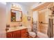 Bathroom featuring a shower with curtain, a toilet, a clock, and a vanity with sink at 4539 Peardale Dr, Las Vegas, NV 89147