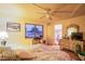 Bedroom featuring a ceiling fan, carpet flooring, a window, a closet, and a bed at 4539 Peardale Dr, Las Vegas, NV 89147
