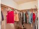 Walk-in closet with clothes hanging on the rack and other personal items inside at 4539 Peardale Dr, Las Vegas, NV 89147