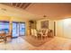 Bright dining area with a view of the pool through sliding glass doors, adjacent to an open backyard at 4539 Peardale Dr, Las Vegas, NV 89147