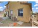 View of the home's backyard featuring a small patio and grass area at 5324 Pendergrass St, North Las Vegas, NV 89081